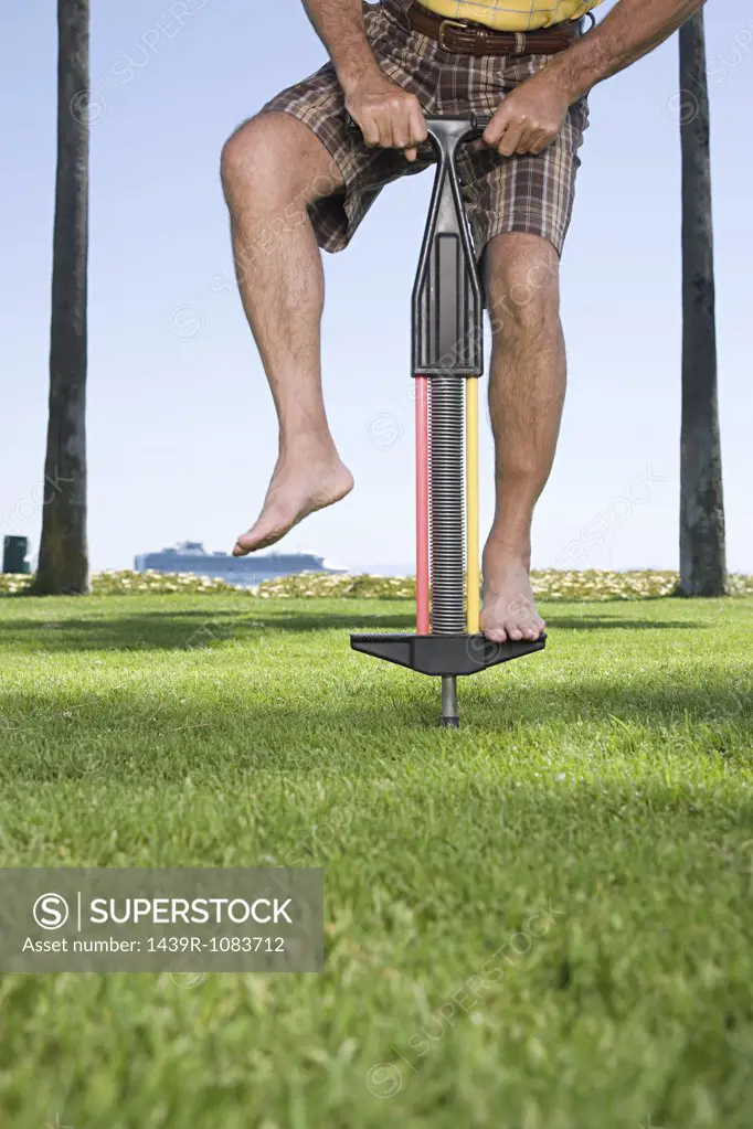 Man using a pogo stick
