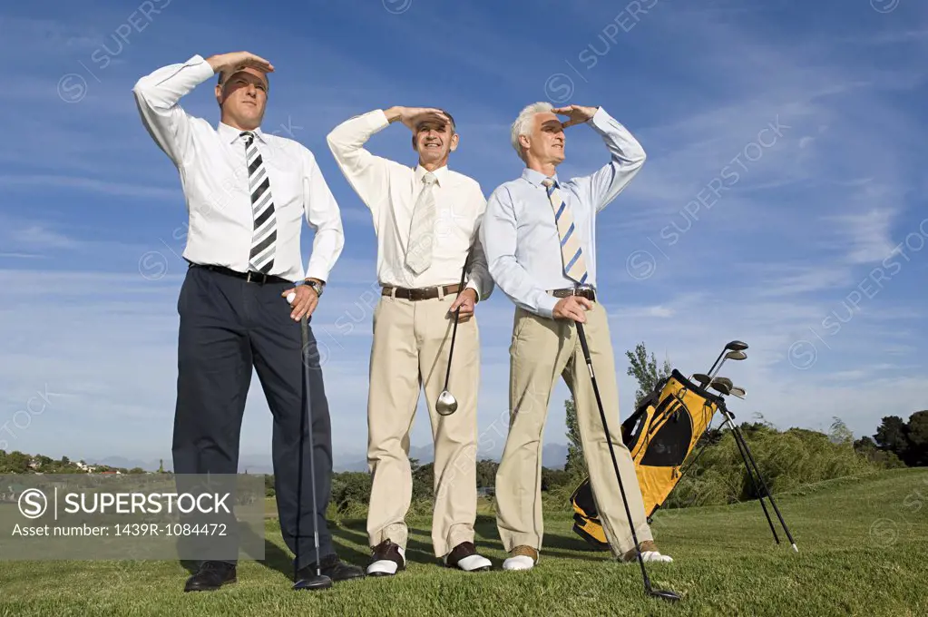 Businessmen playing golf