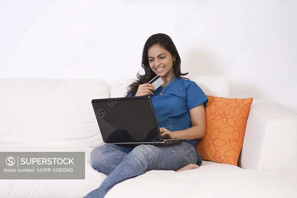 A young woman using a laptop