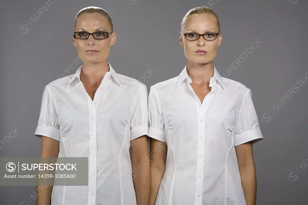 Twin sisters wearing glasses