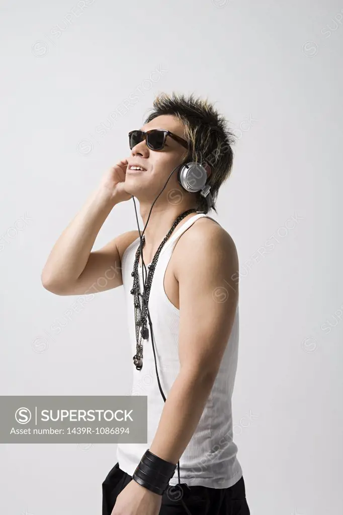 Japanese man listening to music