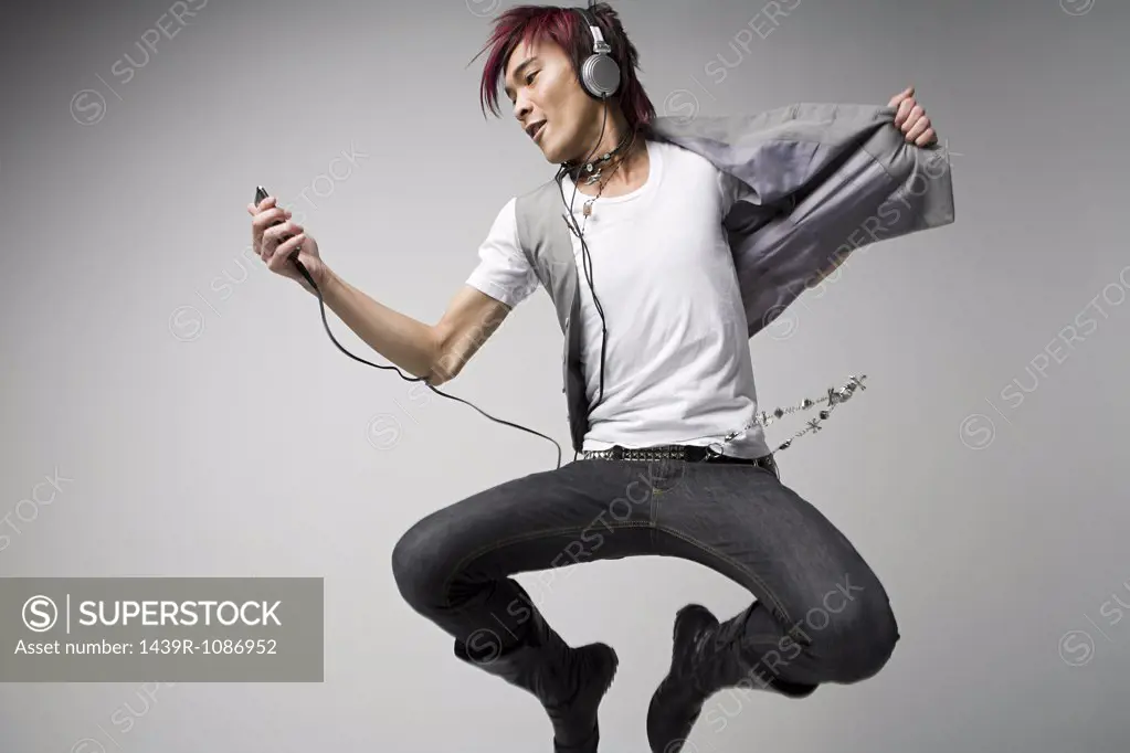 Japanese man listening to mp3 player