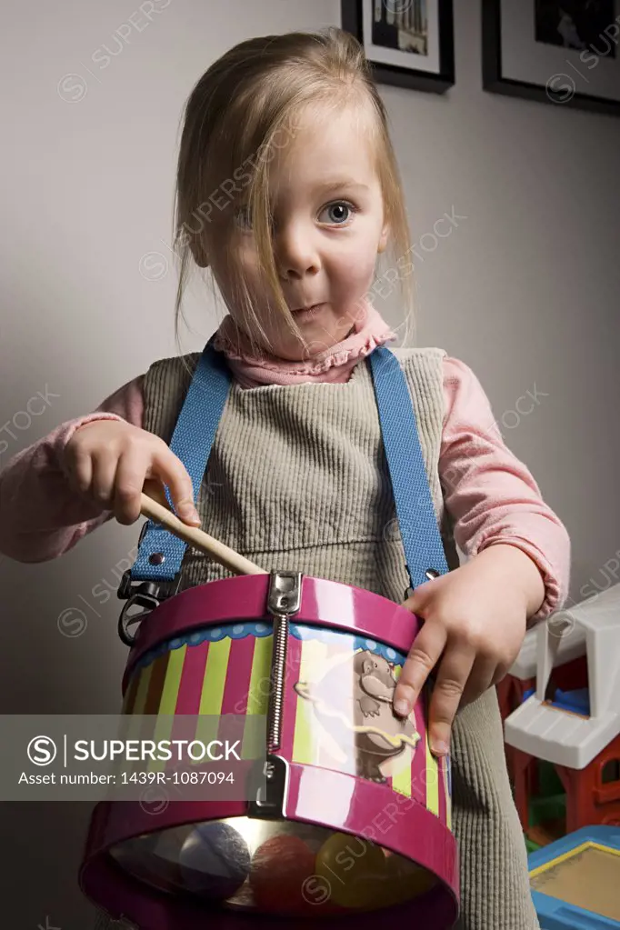 Girl playing a drum