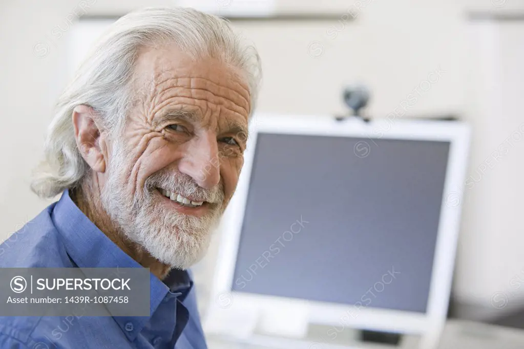 Senior man and computer