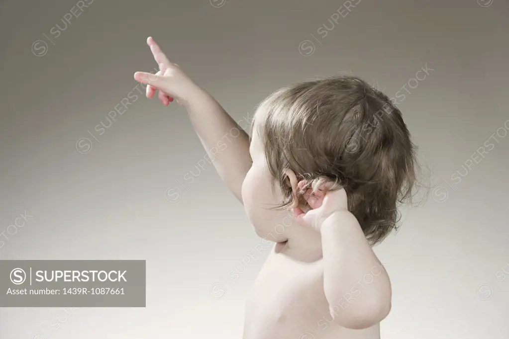 A baby girl pointing
