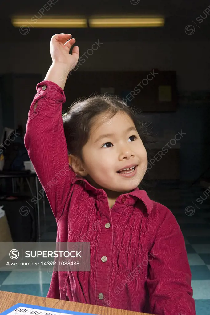 A girl with his arm raised