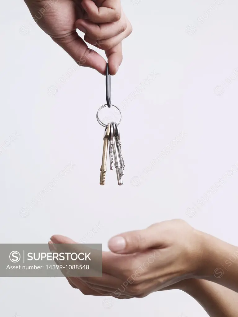 A woman being given keys