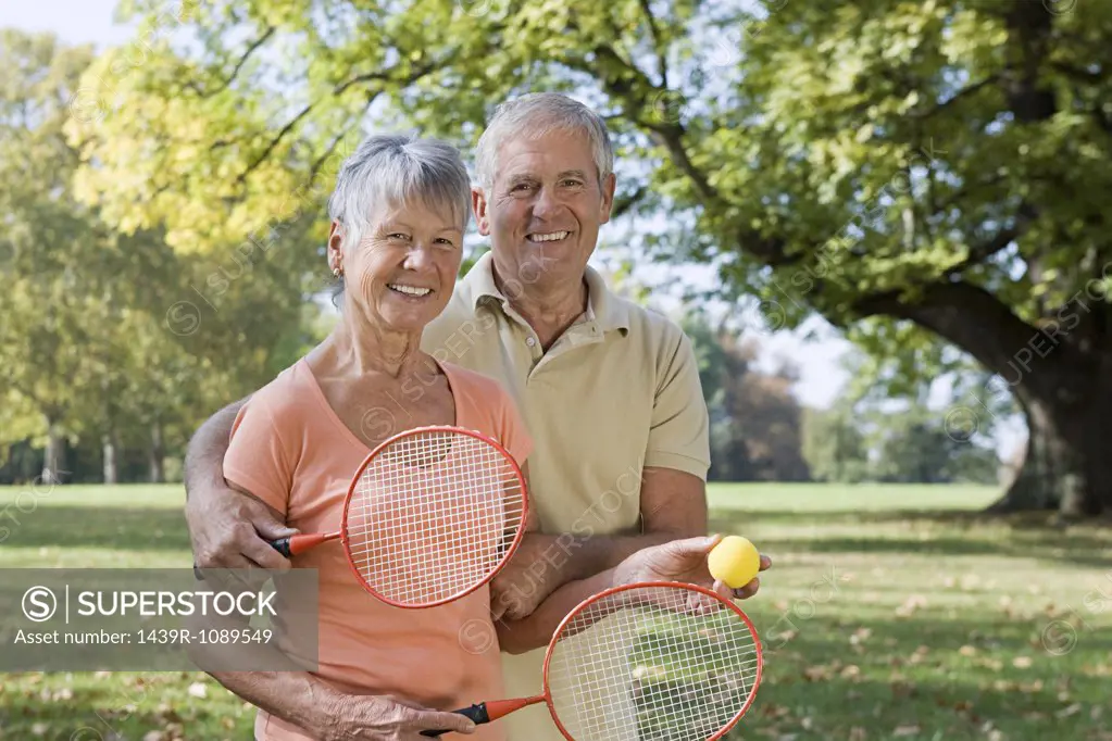 Senior couple playing badminton