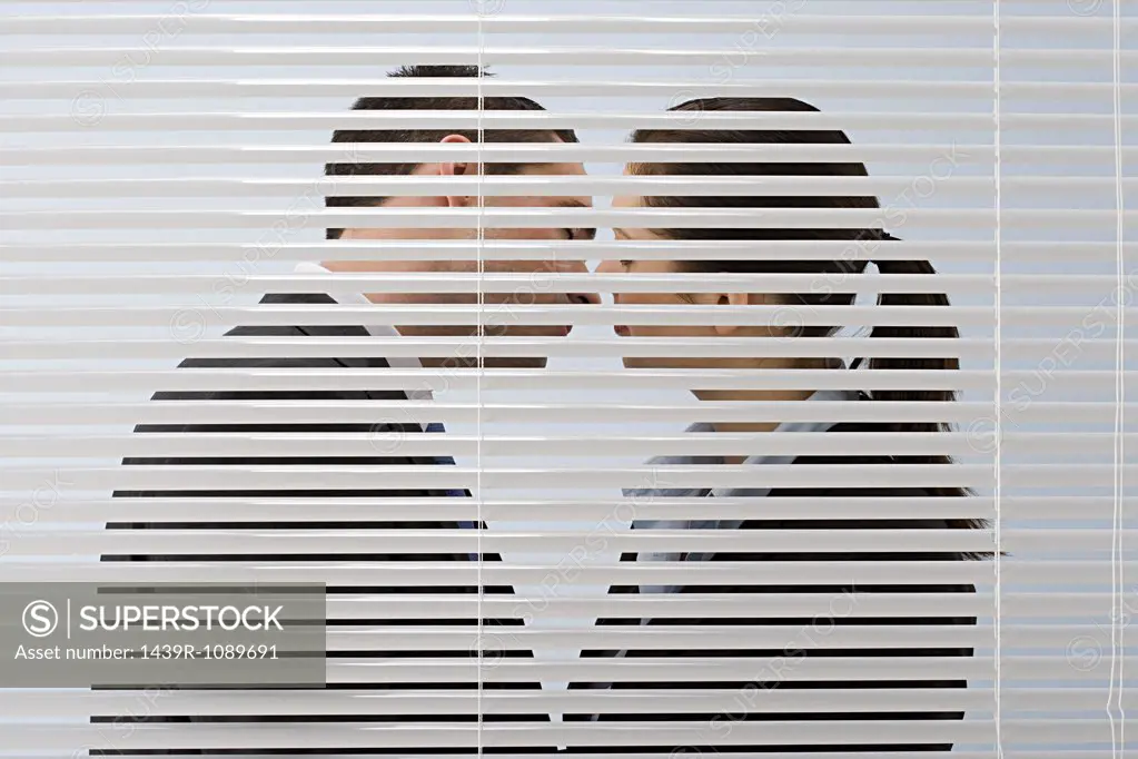 Office workers kissing