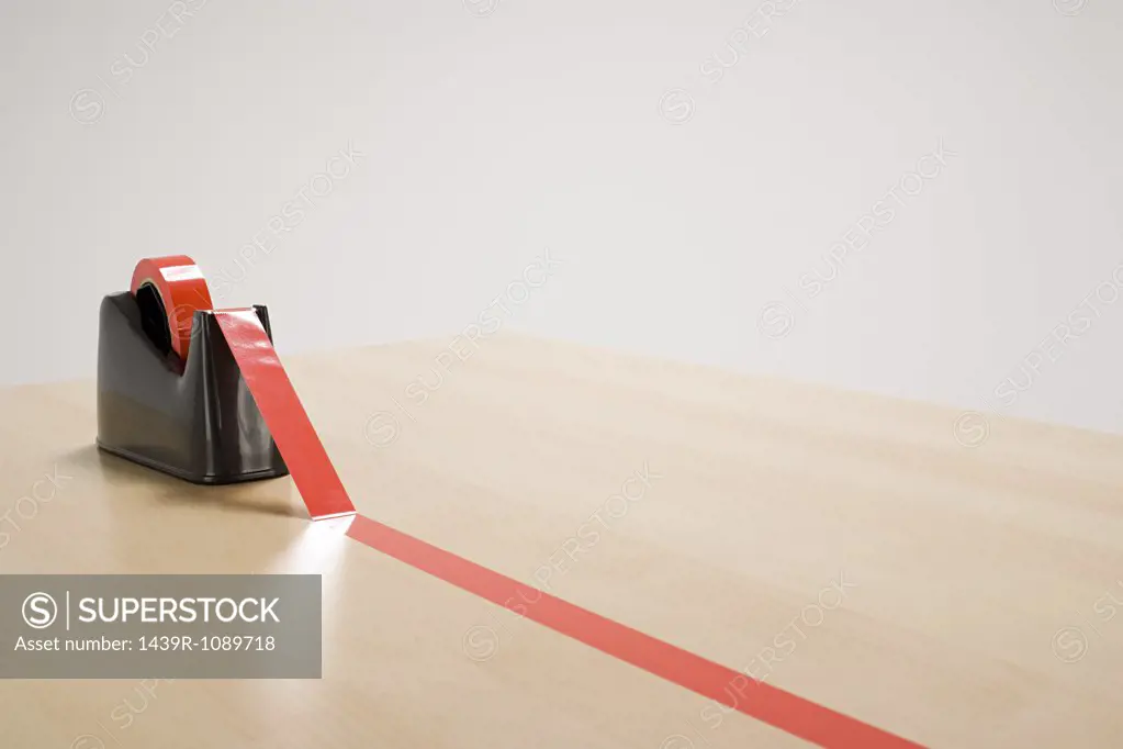 Red tape on desk