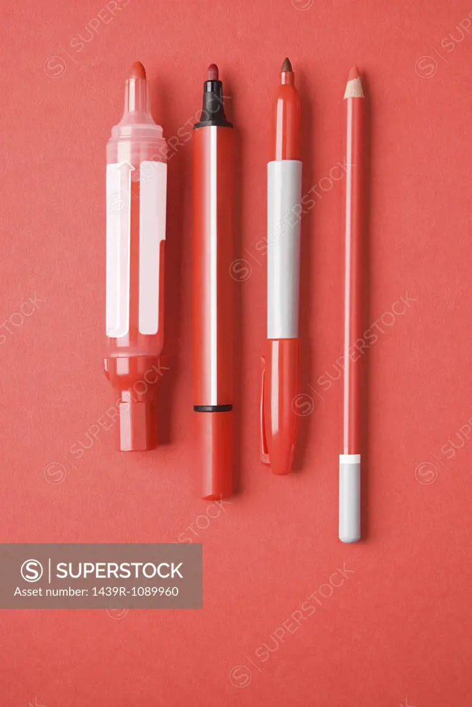 Red pens and pencil