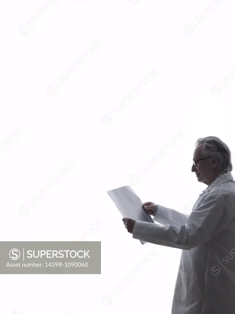 Doctor looking at paper