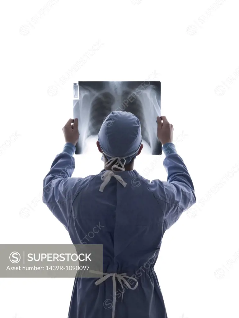 Surgeon looking at x-ray