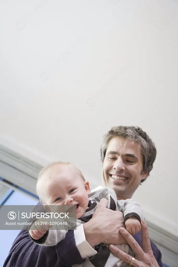 A father holding his son