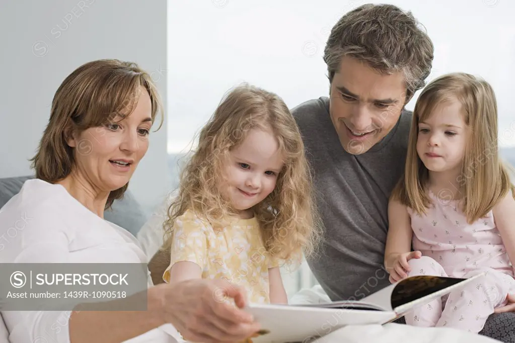 A family reading a book