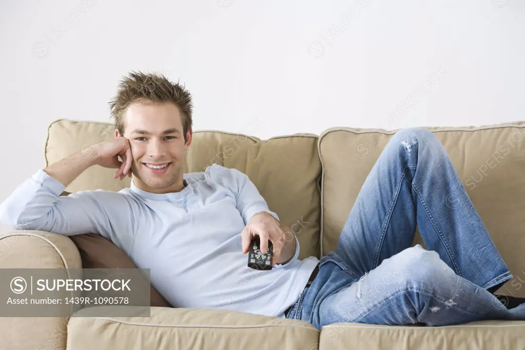 A young man watching tv