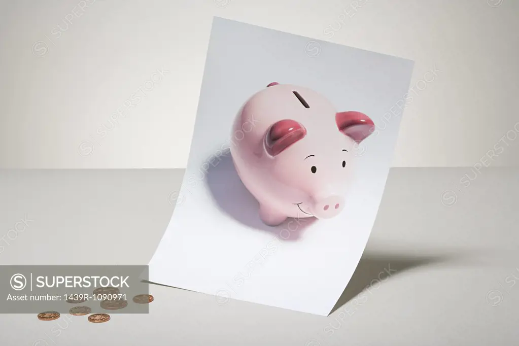 Photograph of a piggy bank and coins