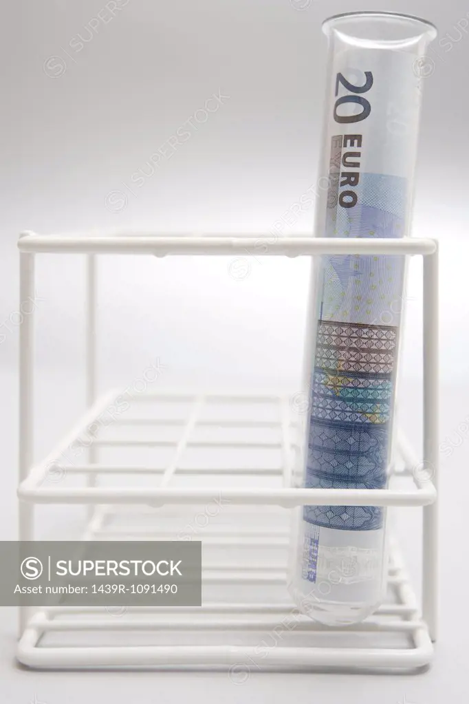 Euro currency in a test tube