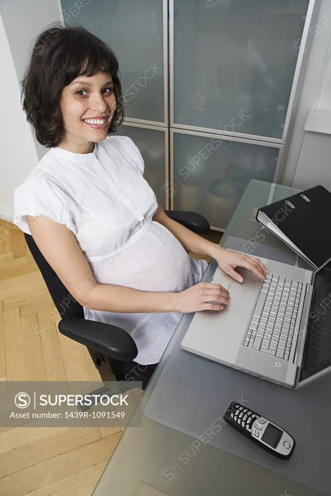 Pregnant woman telecommuting
