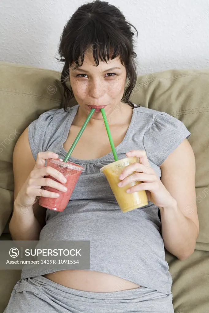 Pregnant woman drinking smoothies