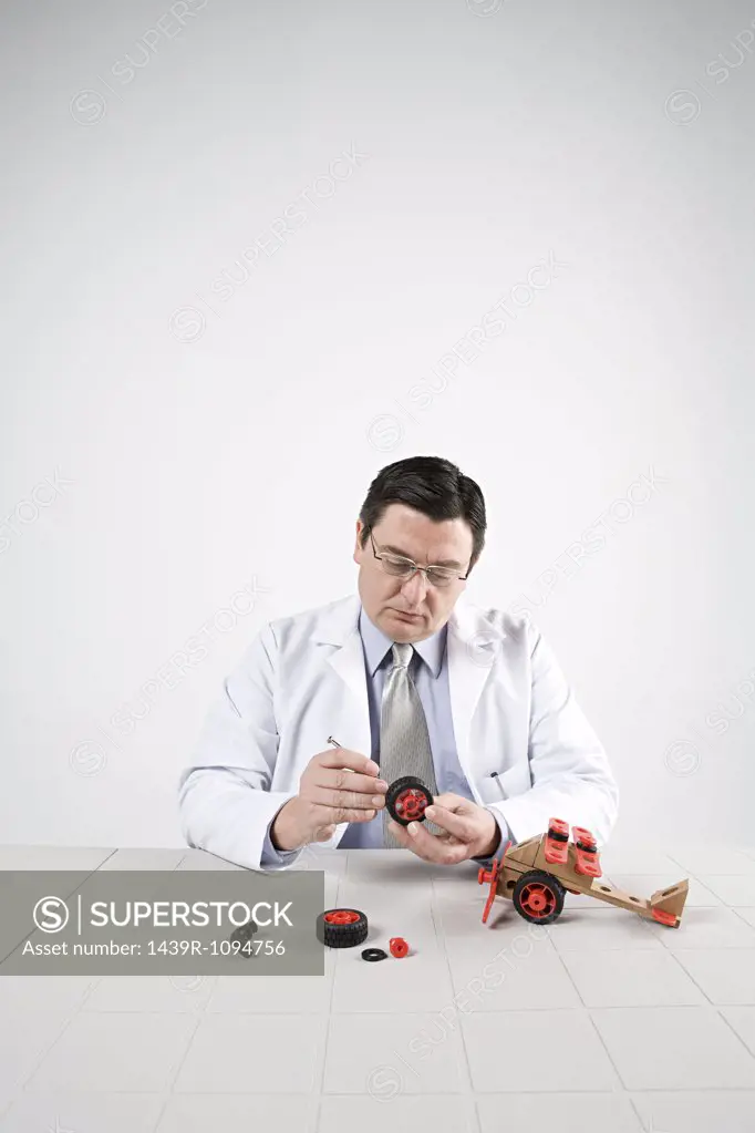 Scientist with model helicopter