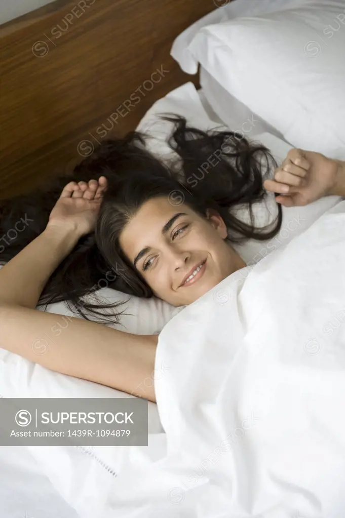 Young woman waking up