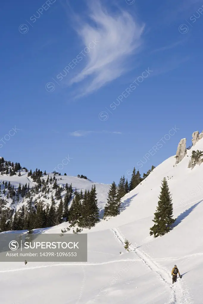 A man walking up a mountain