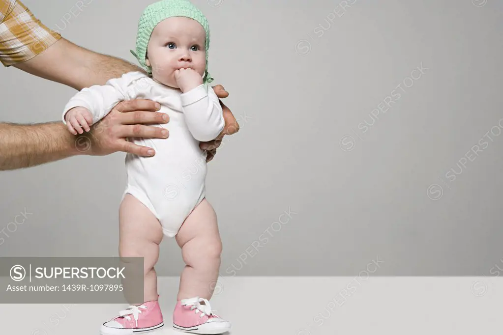 Adult holding baby