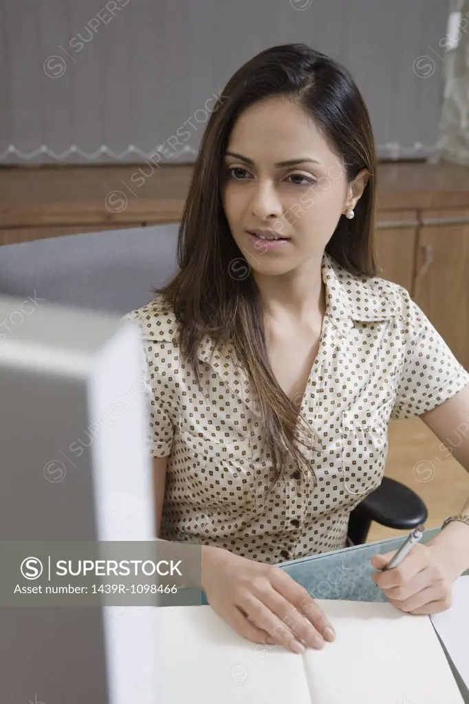 Female office worker at desk