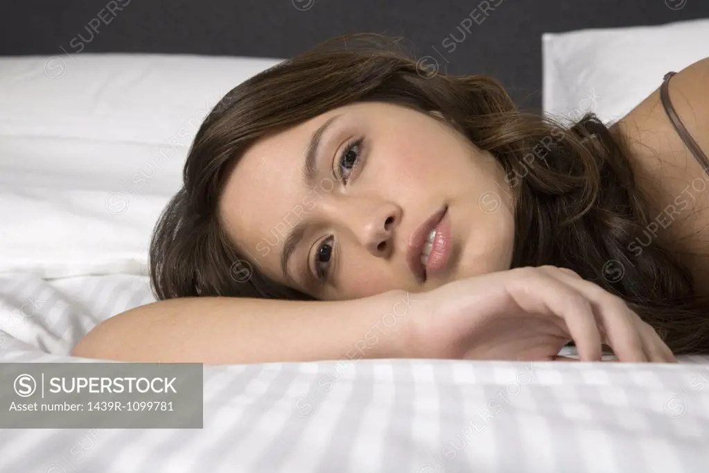 A woman lying on a bed