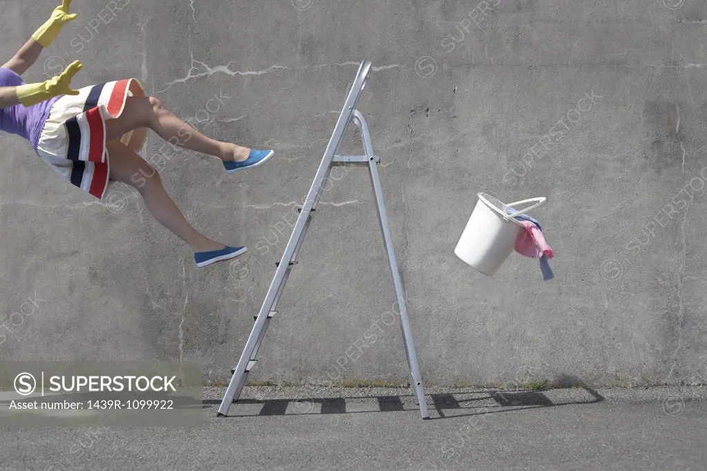 Woman falling off a ladder