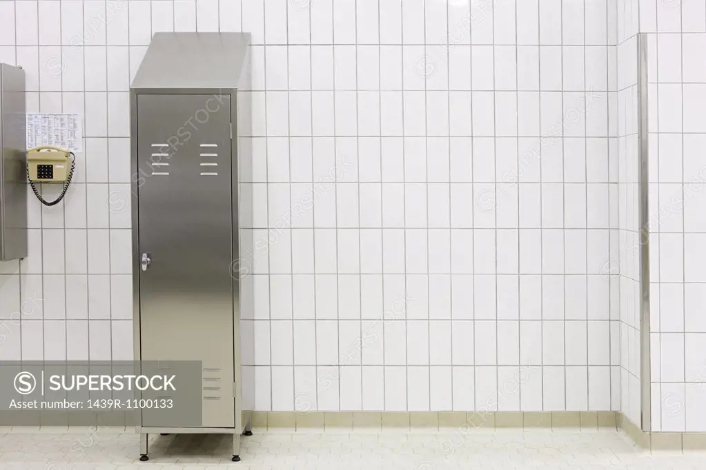 Metal locker in a tiled room