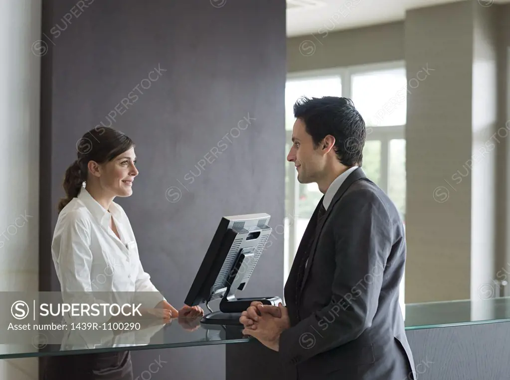 A businessman and a receptionist