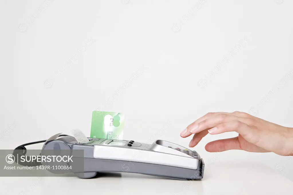 Woman using a chip and pin machine