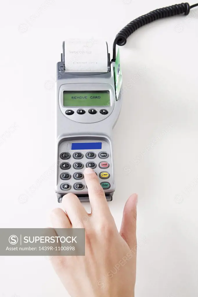 Woman using a chip and pin machine