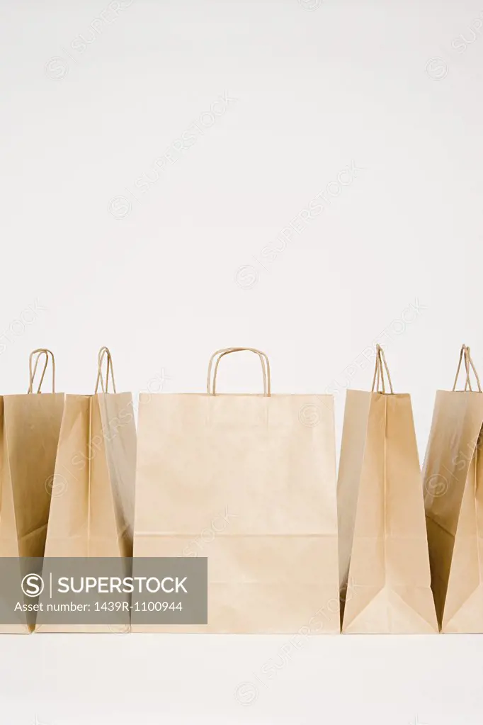 Five paper bags in a row