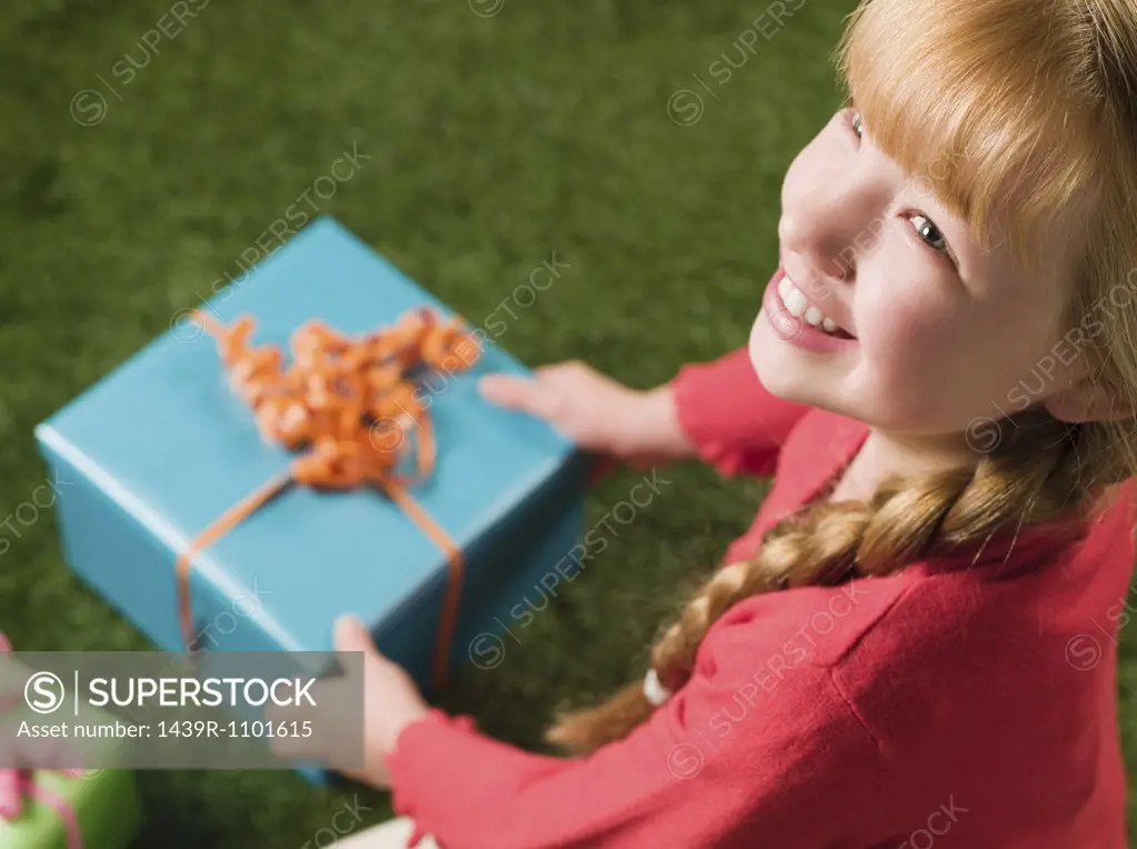 Girl holding a present