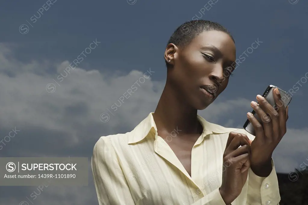 African businesswoman text messaging