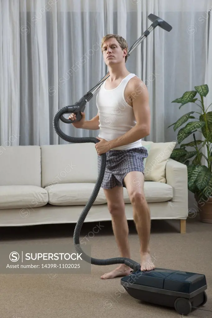 Portrait of a man with a vacuum cleaner