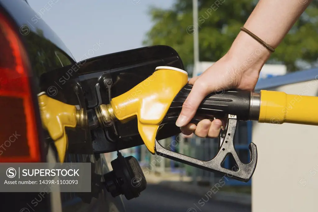 Person using petrol pump