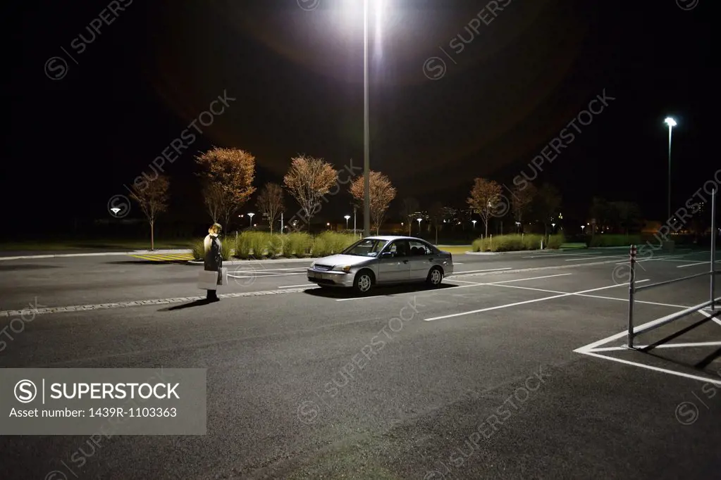 Woman in alone in parking lot