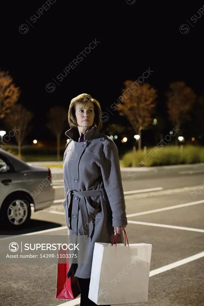 Woman alone in parking lot