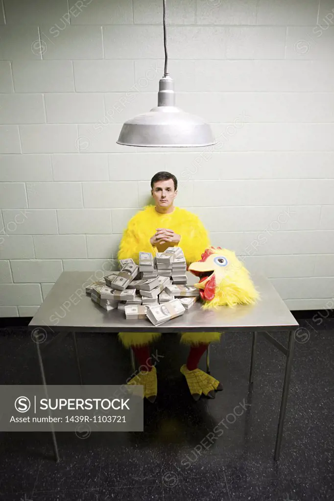 Criminal in chicken suit with money