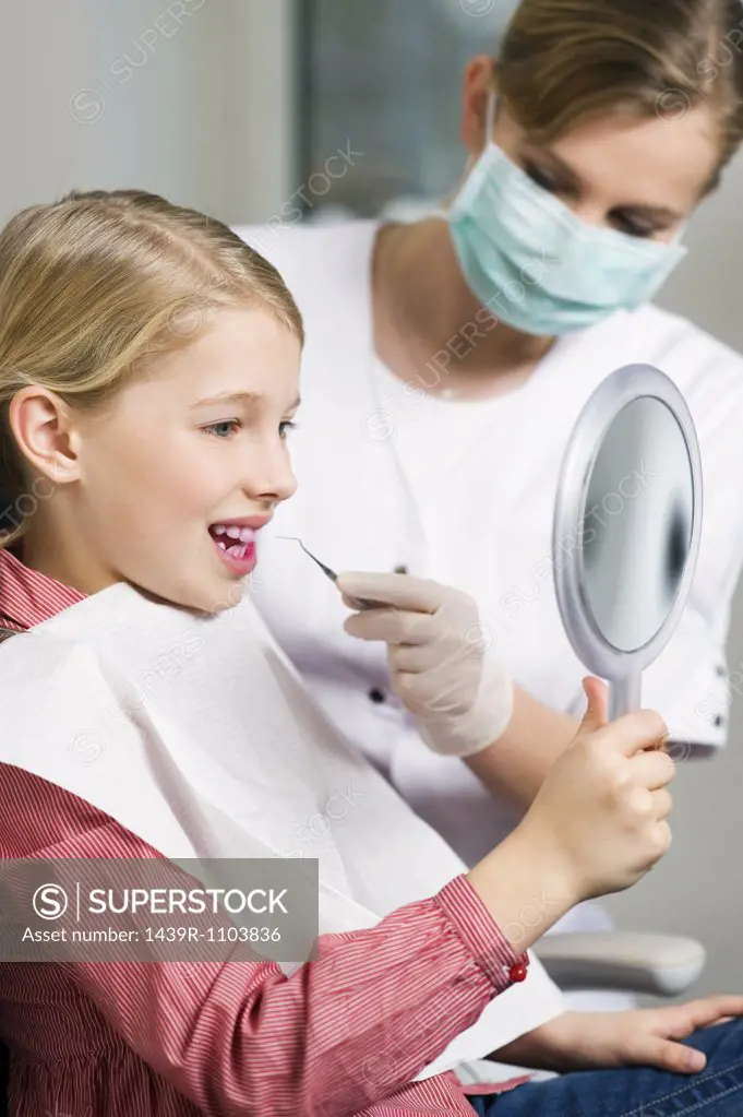 Girl and dental hygienist