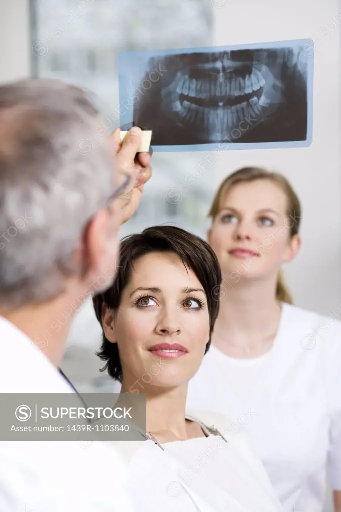 Dentist with patients x-ray