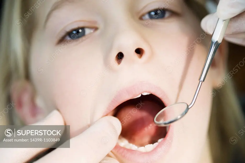 Girl having dental check up