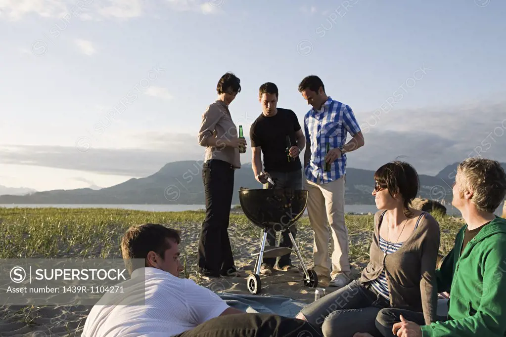Friends having a barbecue on an island