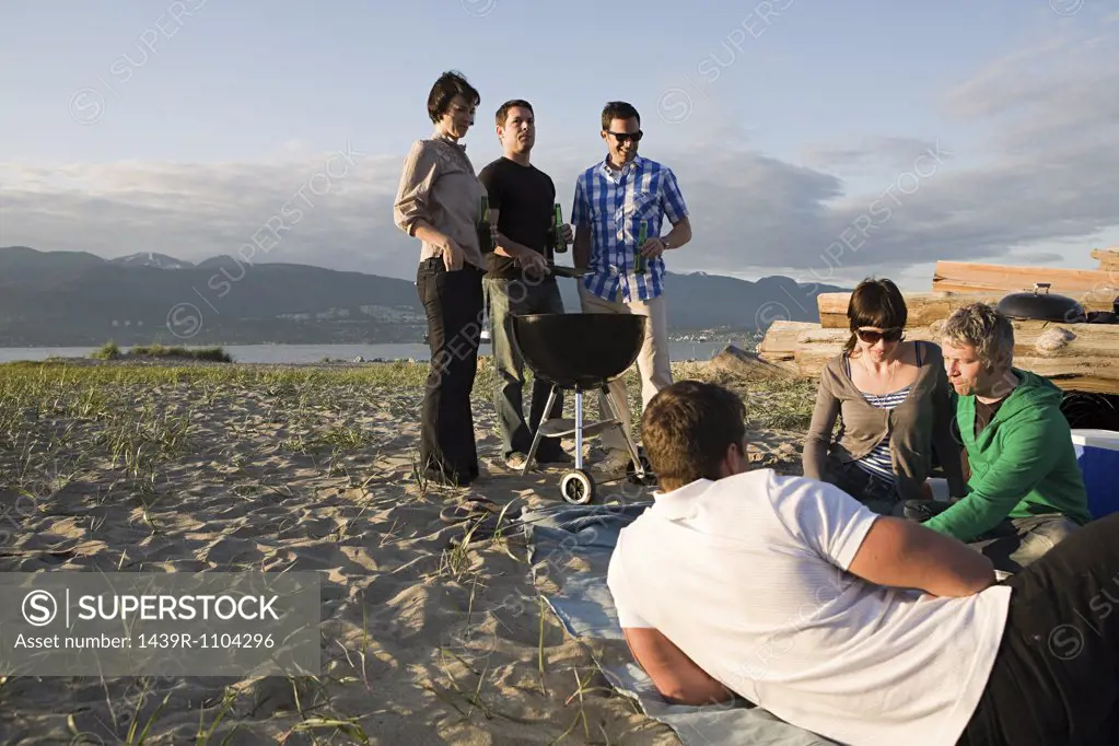 Friends having a barbecue on an island