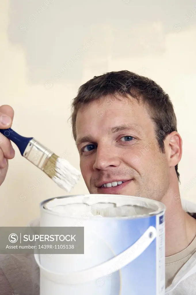 A man holding a paintbrush