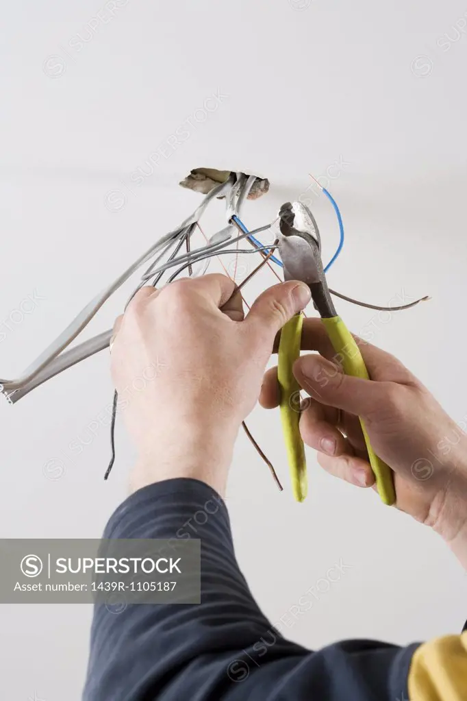 An electrician cutting wires
